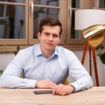 The photo shows Oliver Doring, a client for whom the agency developed a CRM system, using Laravel and Vue js